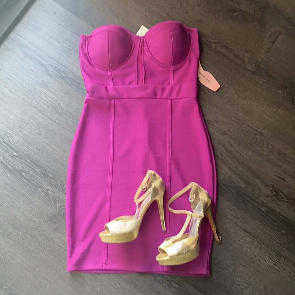 New with tags!   Party dress.  Magenta.   Stretchy fabric.  Built in bra.  Med